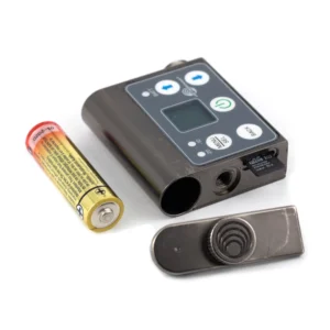 Lectrosonics SMWB Single-Battery Wideband Belt-Pack Transmitter: The transmitter beside an AA battery and its removed battery door.
