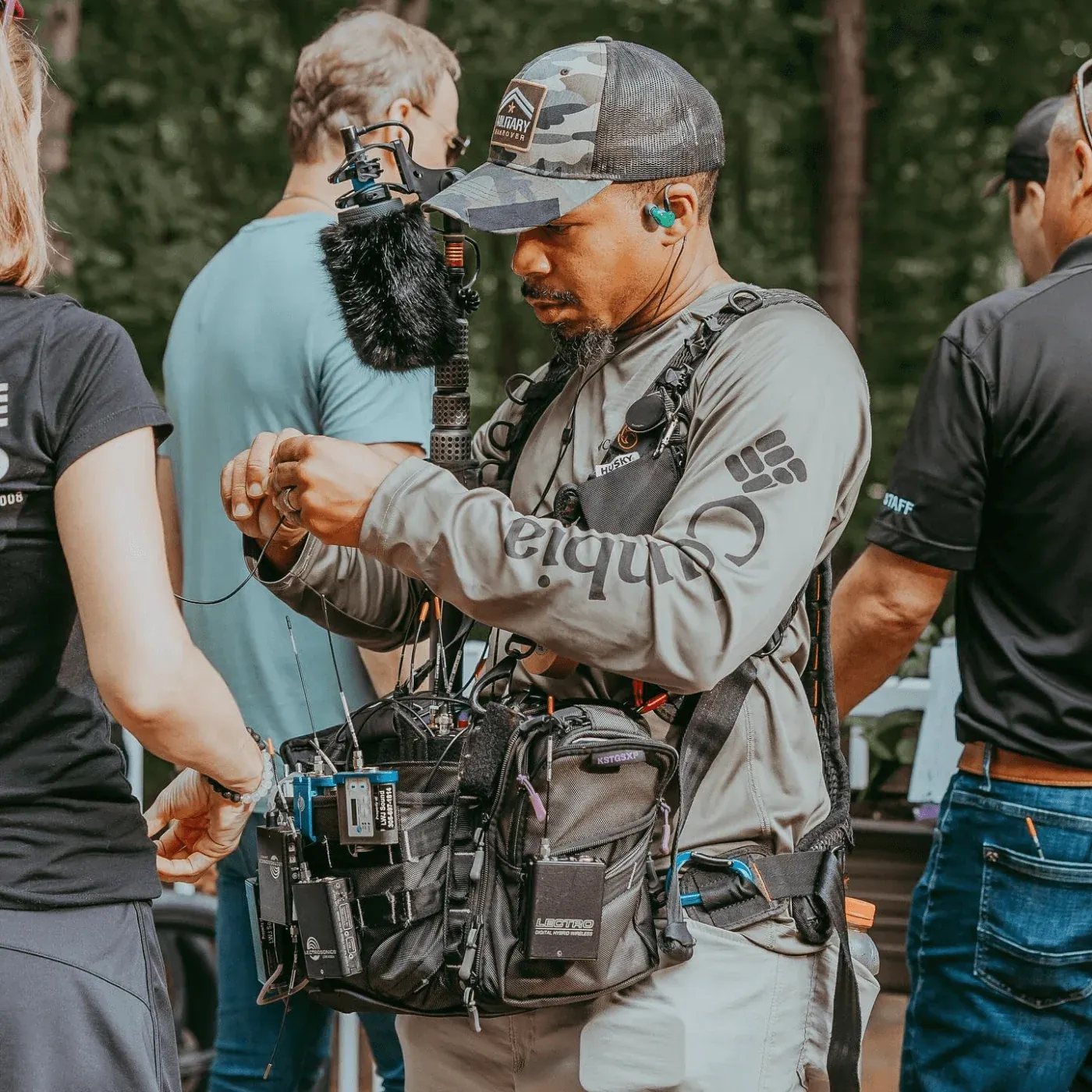 Bubblebee Industries The Windkiller: A sound mixer on location with a Windkiller on the boom.