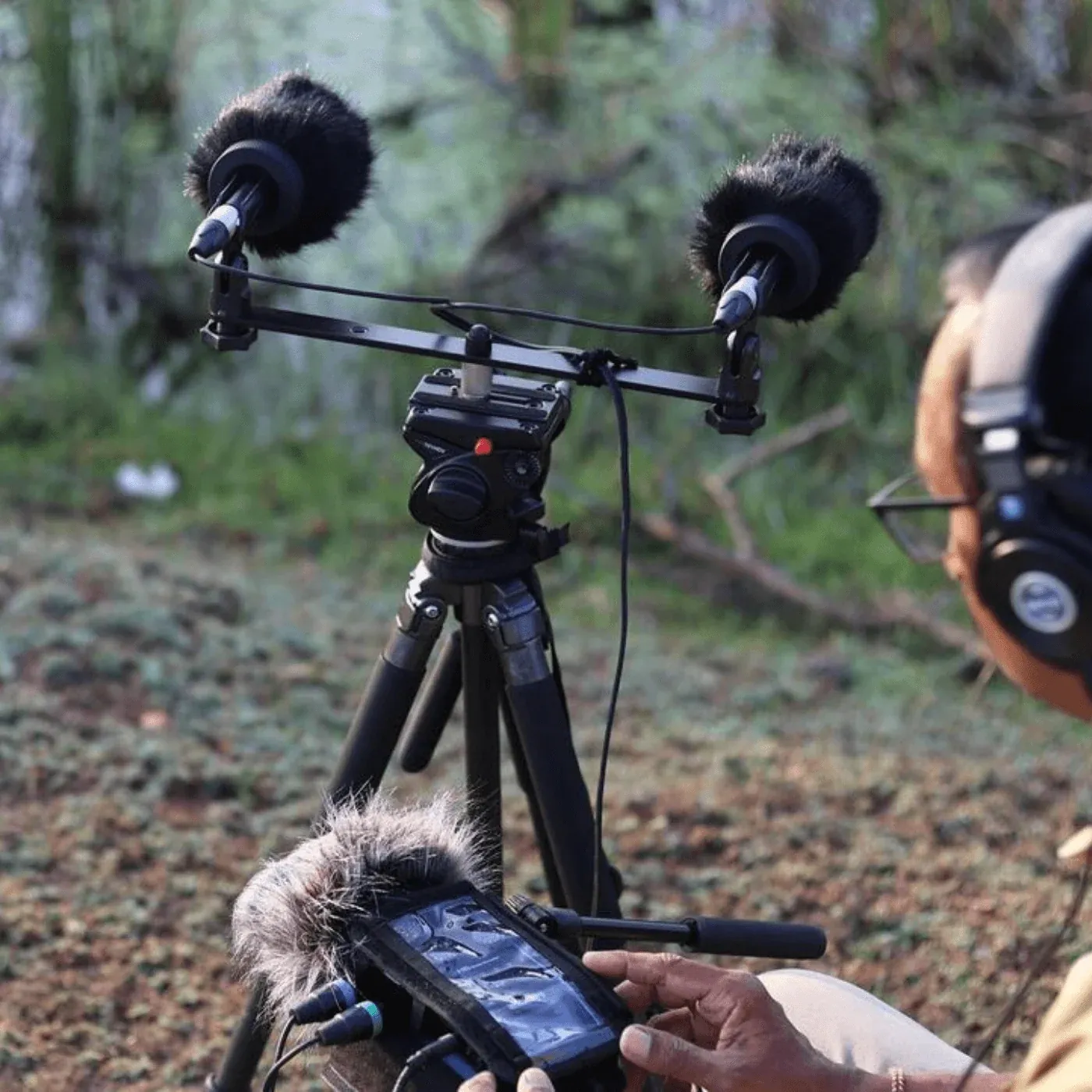 Bubblebee Industries The Windkiller: A stereo pair of mics with Windkillers on a bar outdoors.