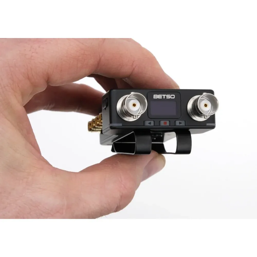 Betso RF Octopus RF Splitter and Diagnostic Tool: The splitter held in one hand, showing its compact size.