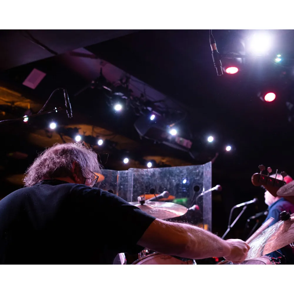 DPA 2015 Wide Cardioid Microphone: A drummer on stage with the mics overhead.