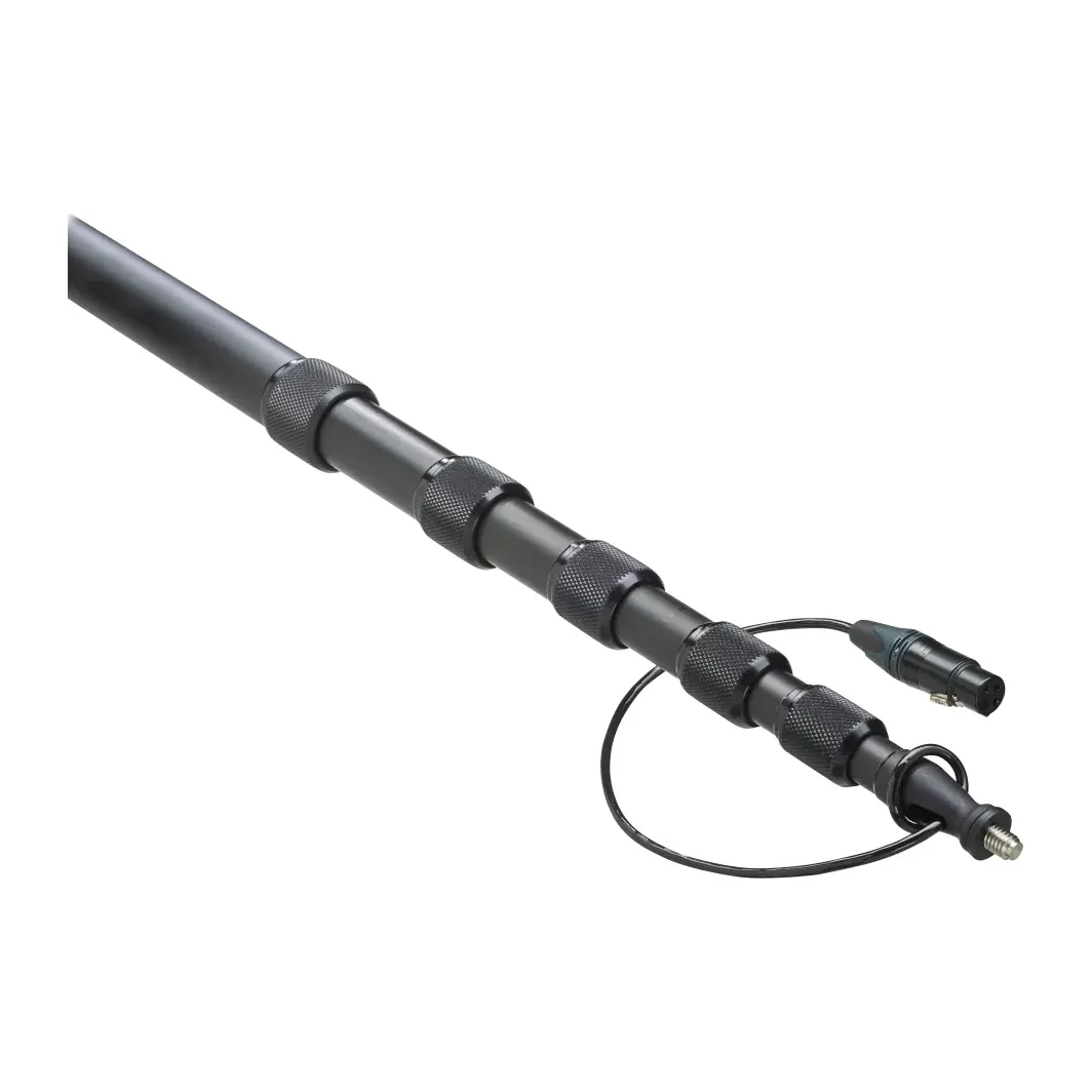 K-Tek KE79CC Avalon Traveler Boom Pole (Coiled Cable): the extended top sections and knurled collars, with the cable's XLR on a short loop.