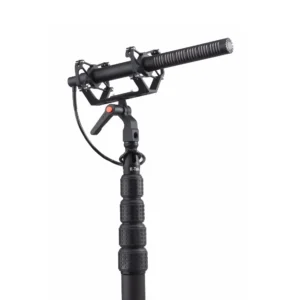 K-Tek KGPS General Purpose Shock Mount: on a boom pole, holding a shotgun mic.