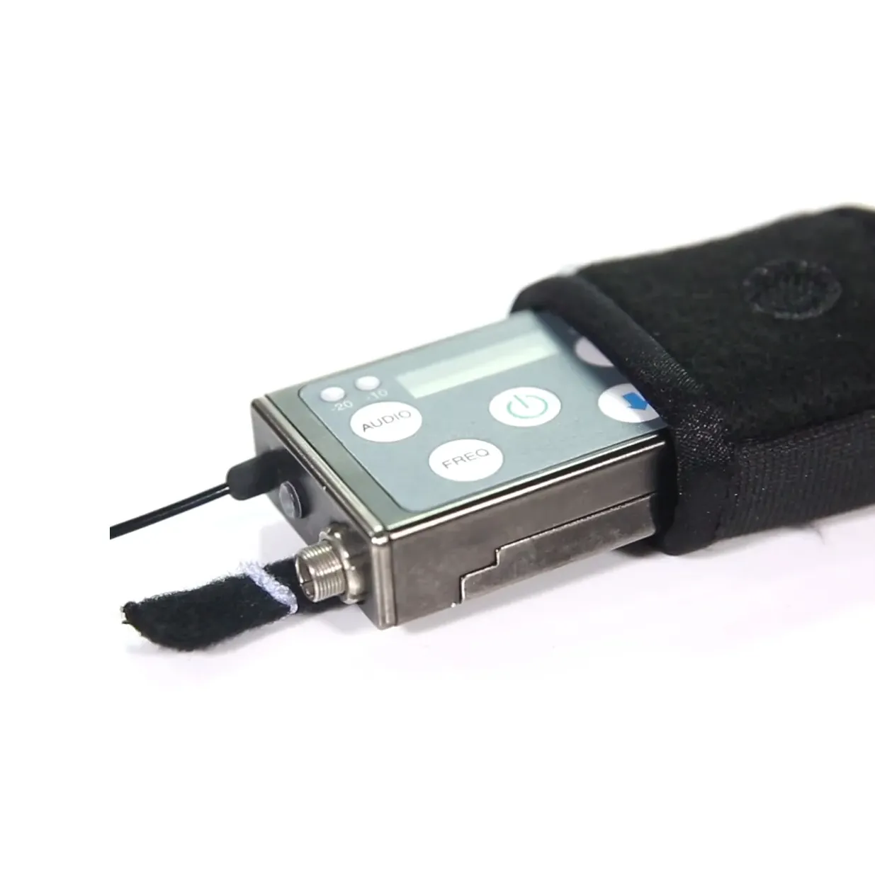 K-Tek KSHPMINI Stingray HeatBlock Transmitter Pouch - Mini: a transmitter sliding out of the pouch, with the strap's tab open.
