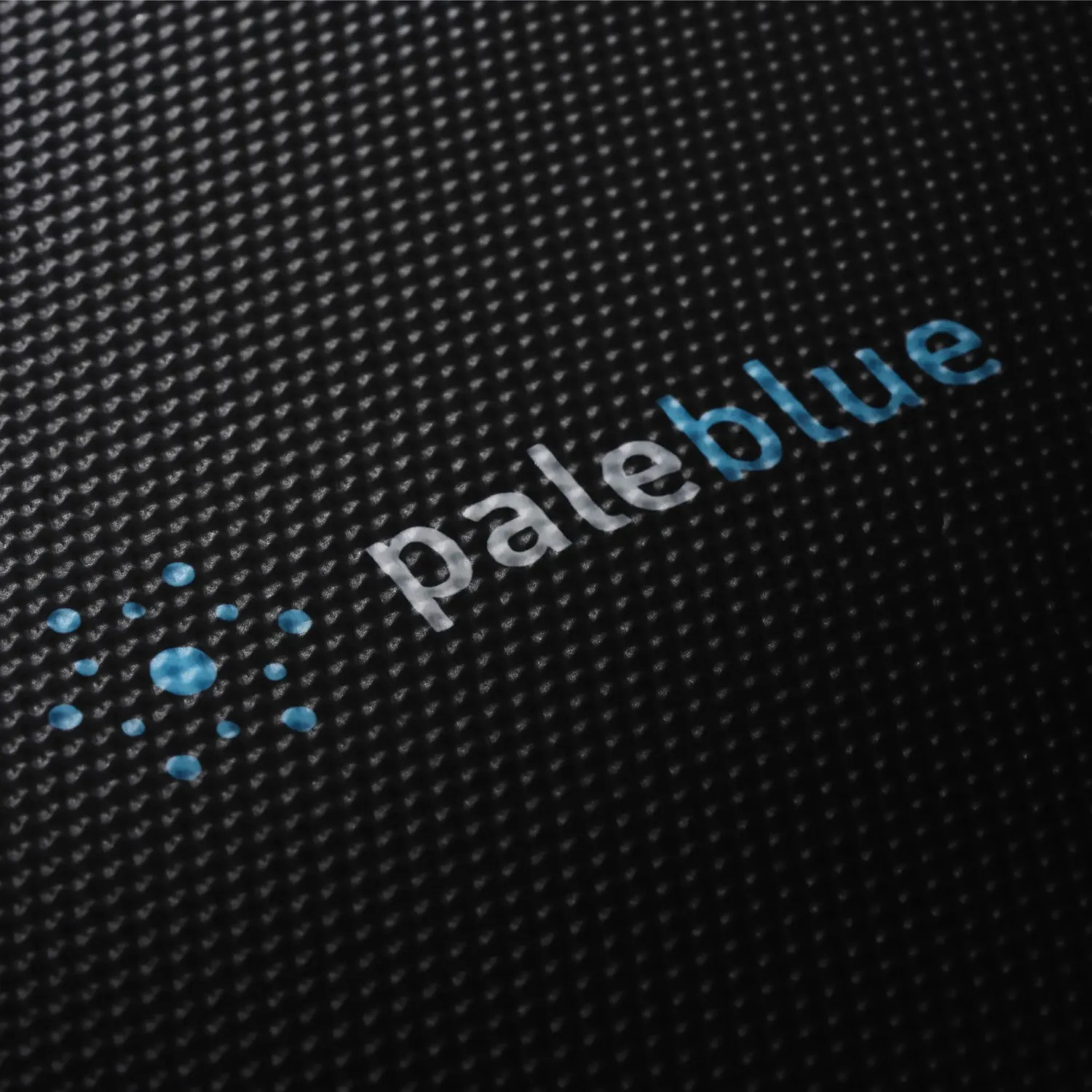 Paleblue Approach 2 Triple-Panel Solar Charger close up, showing the panel's woven finish and the Paleblue logo.