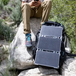 Paleblue AA & AAA Solar Power Kit with Approach 2 Solar Charger: the Approach 2 Solar Charger strapped to a backpack on a rock in the sun.