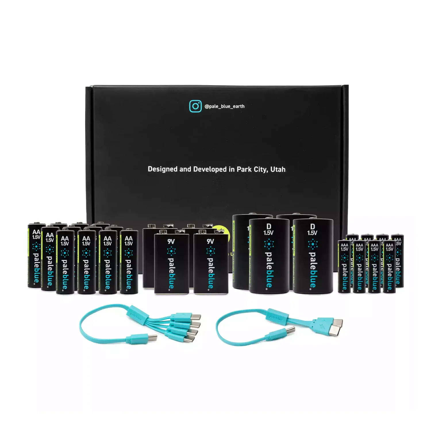 Paleblue Voyager Home Conversion Kit with 28 Rechargeable Batteries laid out in front of its box: AA, AAA, D, and 9V cells with USB-C charging cables.