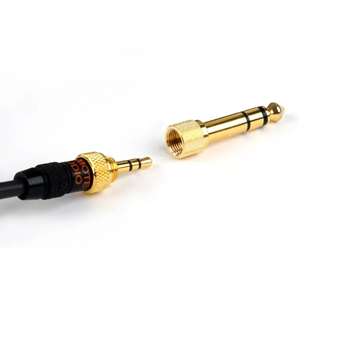 Remote Audio HN-7506 High-Noise Headphones: Locking 3.5 mm plug and threaded 1/4-inch adapter.
