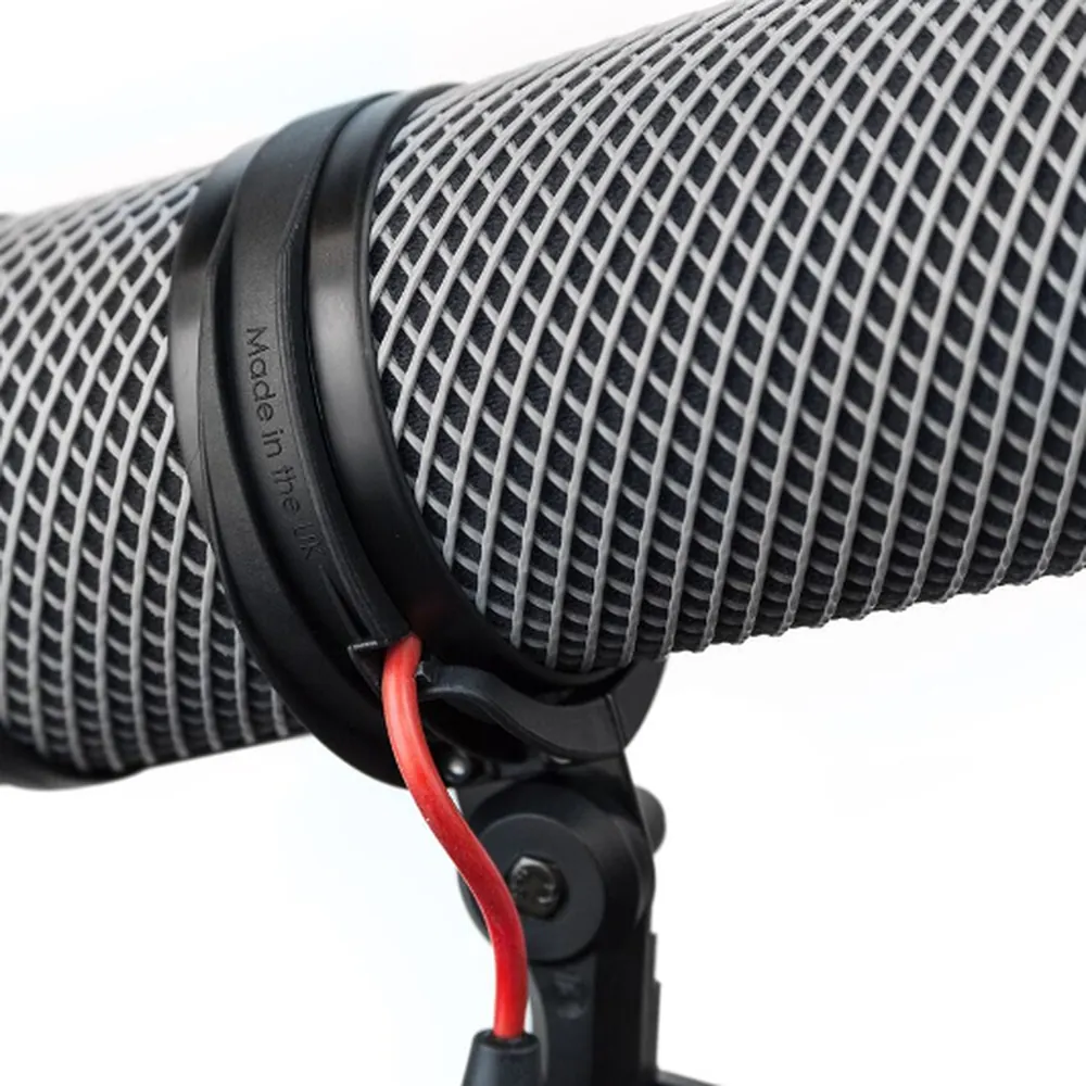 Rycote Super-Blimp Kit NTG Windshield and Shock Mount Kit: The windshield's mesh basket up close, a Lyre ring around it and the red cable lead running down to the handle.