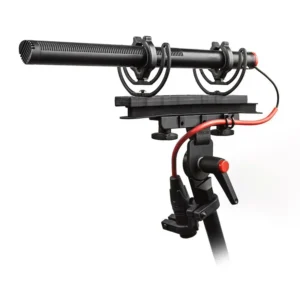 Rycote Windshield Kit 416 for Sennheiser MKH 416: A shotgun mic in the red Lyre suspension on a boom pole.