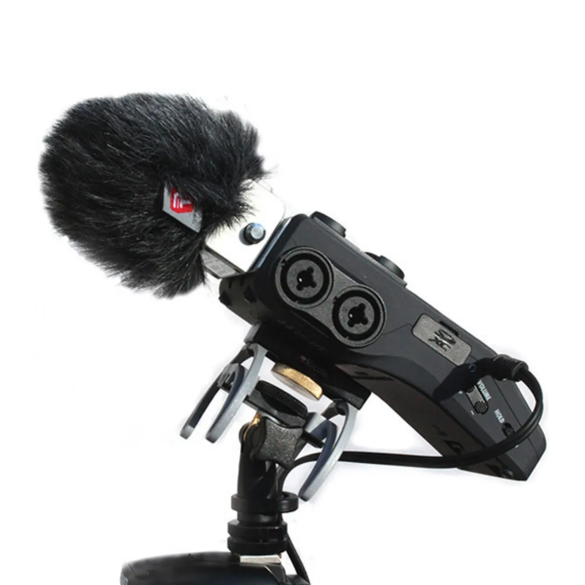 Rycote Portable Recorder Suspension HD: A recorder with a Mini Windjammer in the suspension, tilted on its swivel.