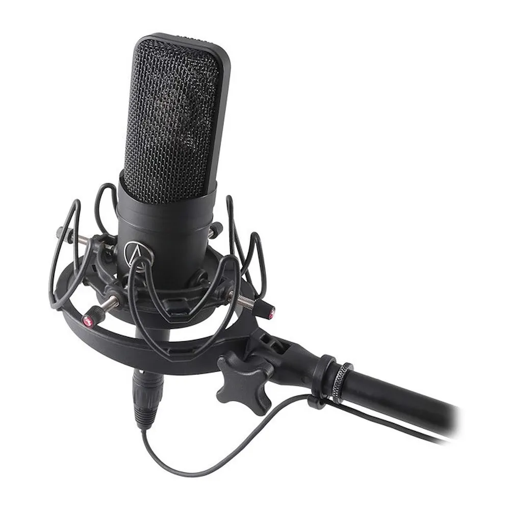 Rycote InVision USM Universal Studio Shock Mount: USM holding a black studio mic on a stand arm.