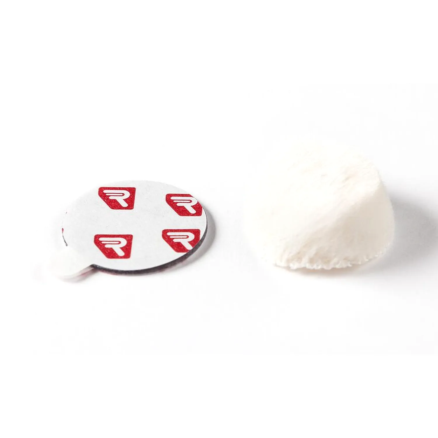 Rycote Overcovers Advanced - White: A white Overcovers Advanced fur disc beside a sheet of round Stickies.
