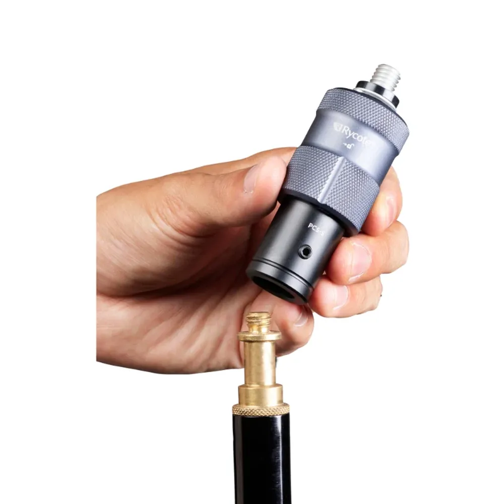 Rycote PCS Spigot being fitted by hand onto the 5/8 inch spigot of a microphone stand.