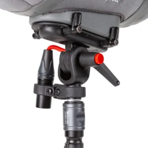 Rycote Cyclone Adaptor for PCS-Boom Connector up close under a Cyclone windshield, with its XLR holder and red-tipped lever above a PCS-Boom Connector.