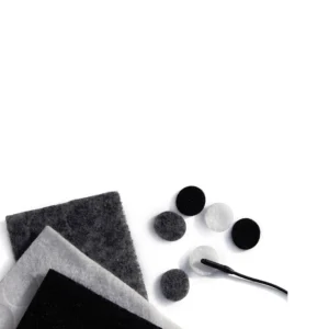 Rycote Undercovers Fabric Discs for Lavalier Mics: Fabric squares and discs in black, gray, and white beside a lavalier mic.