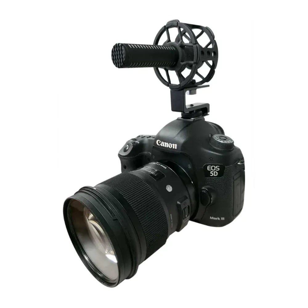Sanken CS-M1 Short Super Cardioid Shotgun Microphone: The mic in a shock mount on a DSLR camera.