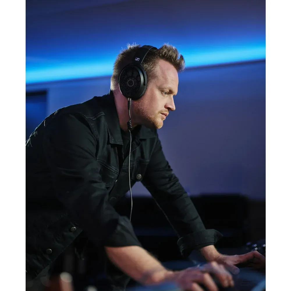 Sennheiser HD 490 PRO Open-Back Reference Headphones: An engineer at a mixing console wearing the HD 490 PRO.