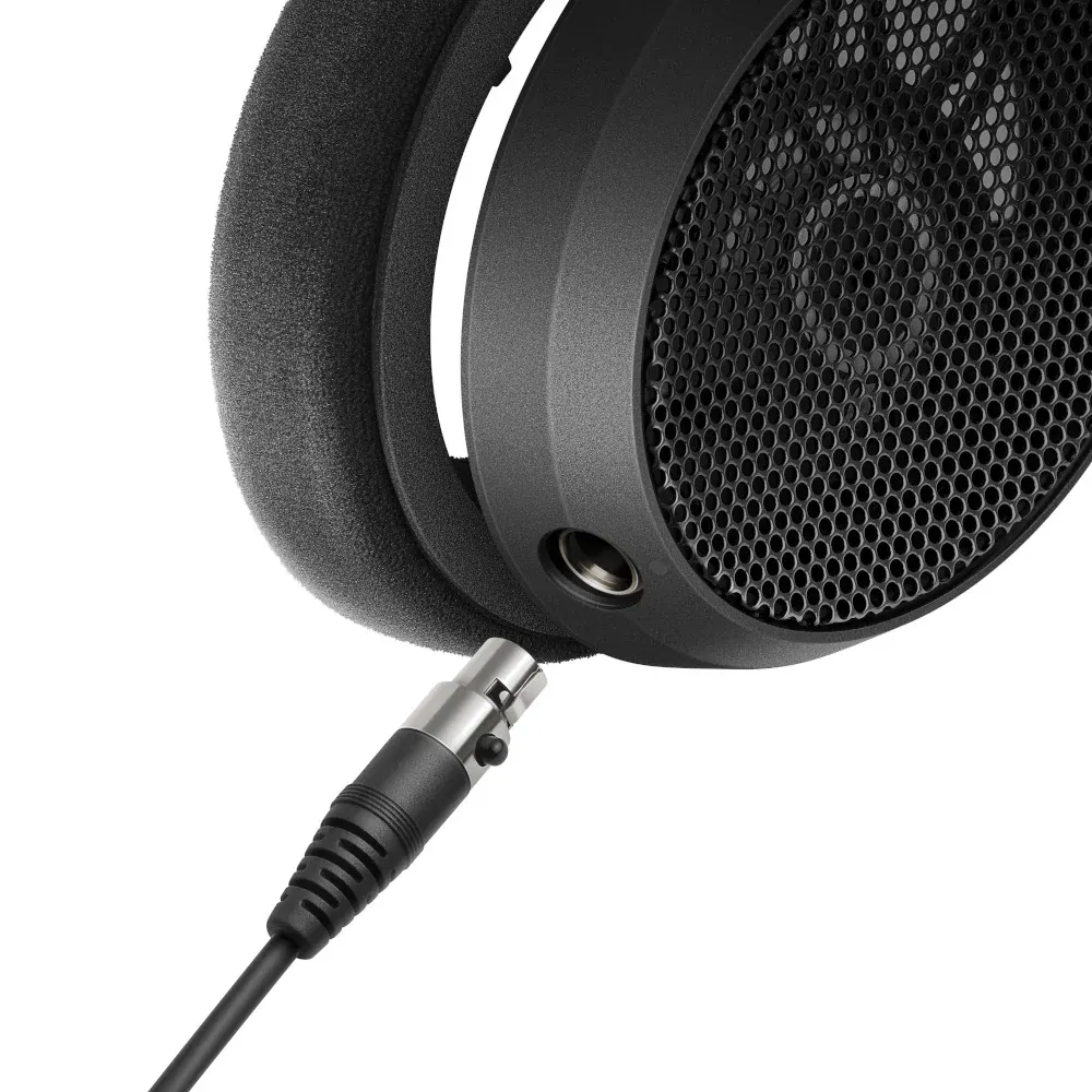 Sennheiser HD 490 PRO Open-Back Reference Headphones: A close view of an earcup's open mesh and its cable jack.