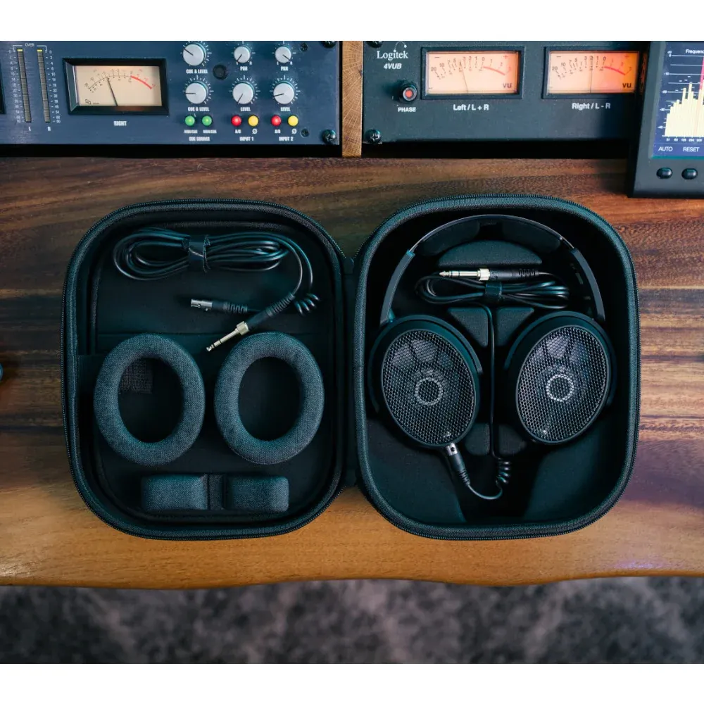 Sennheiser HD 490 PRO Open-Back Reference Headphones: The HD 490 PRO Plus case open on a desk, with the headphones, pads, and cables.