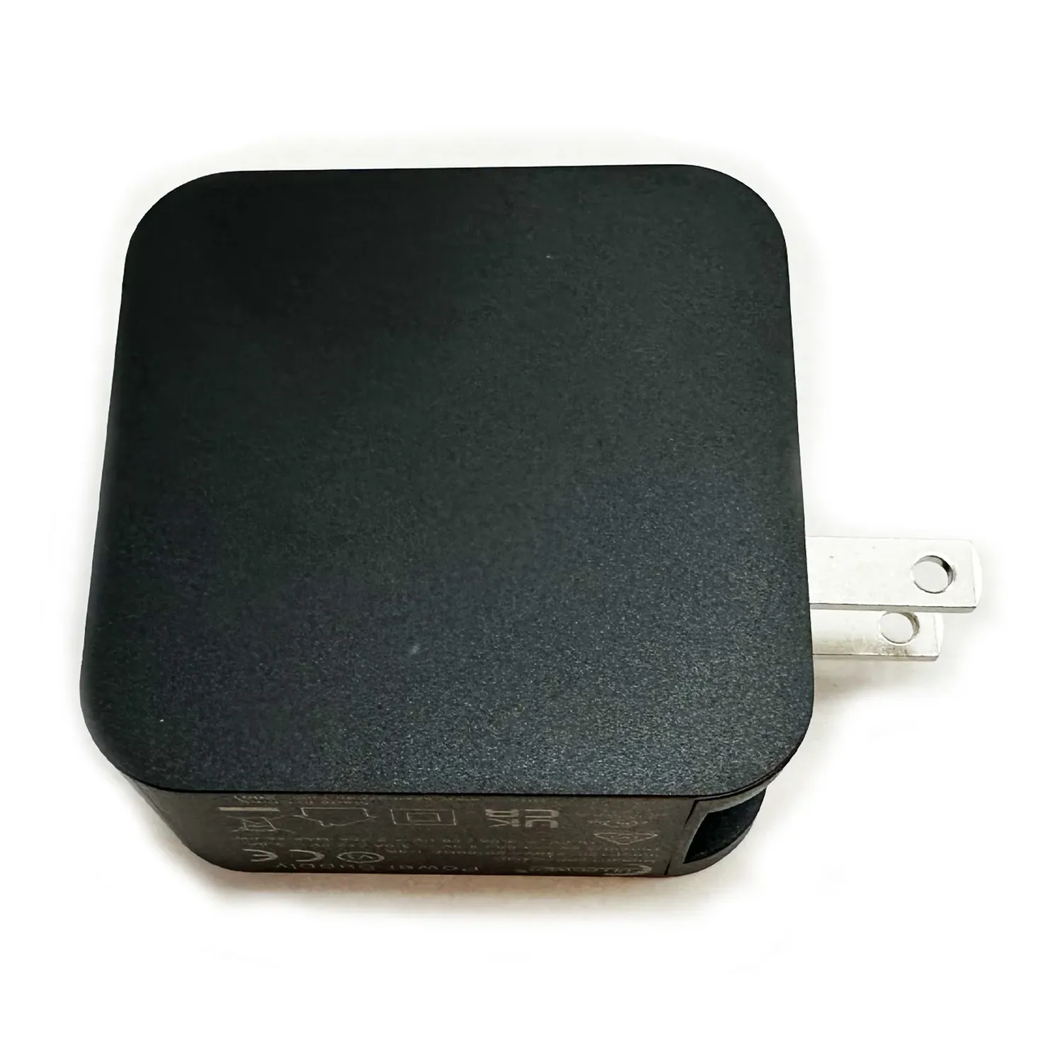 Sound Devices Astral PowerStation PSU (45W): The black wall power supply, seen from above, with its US plug blades.