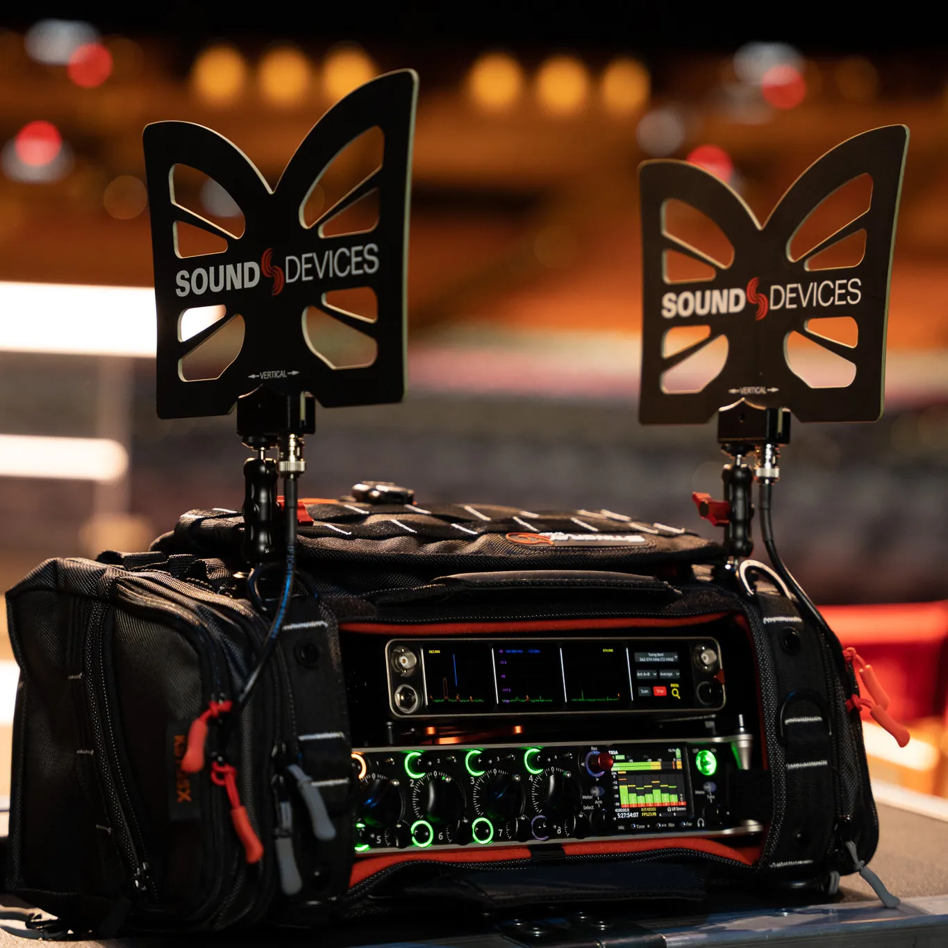 Sound Devices Astral ARX16 Digital Wireless Receiver: The ARX16 in a production bag with Monarch antennas, in a theater.