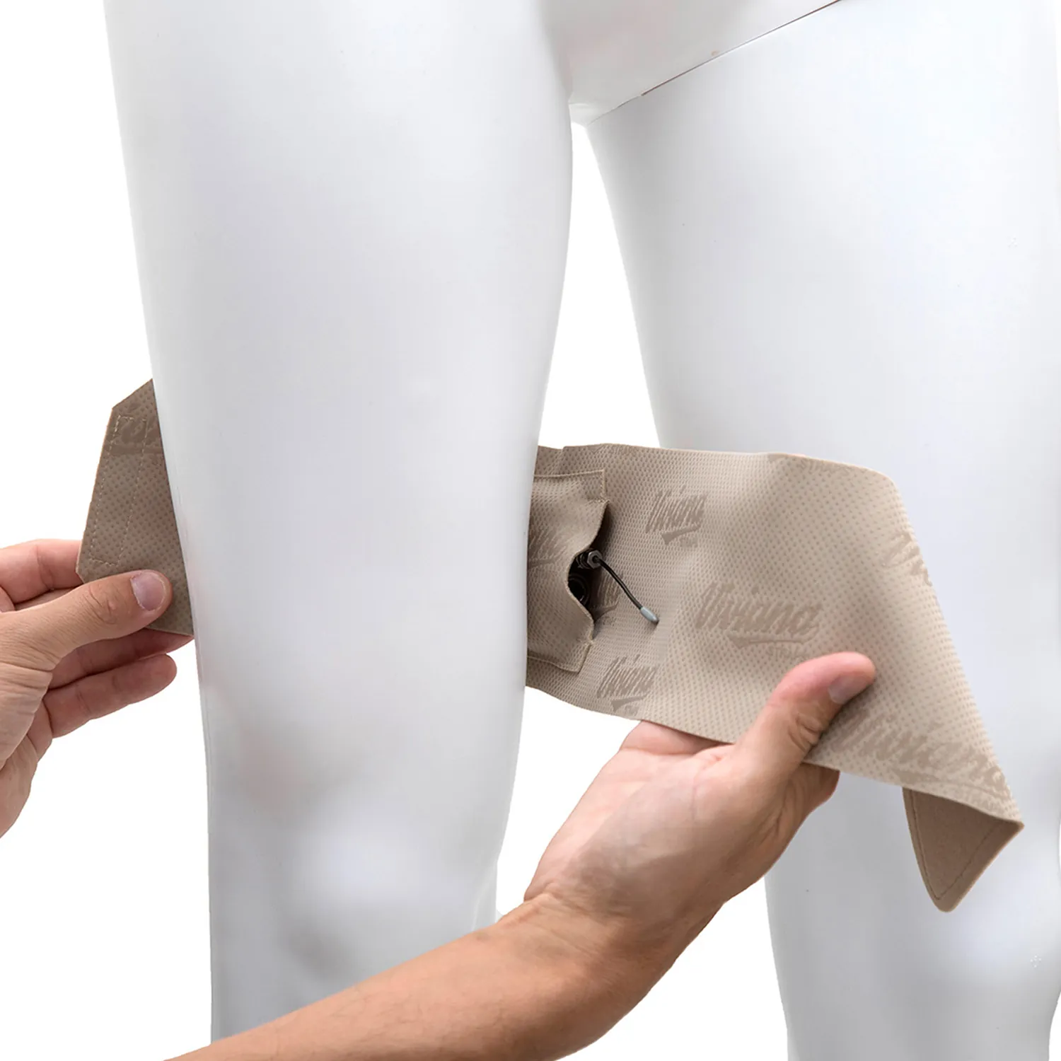 Viviana Straps Extreme Thigh (Horizontal Pouch) in beige, held open against a mannequin's thigh to show the transmitter in its horizontal pouch.