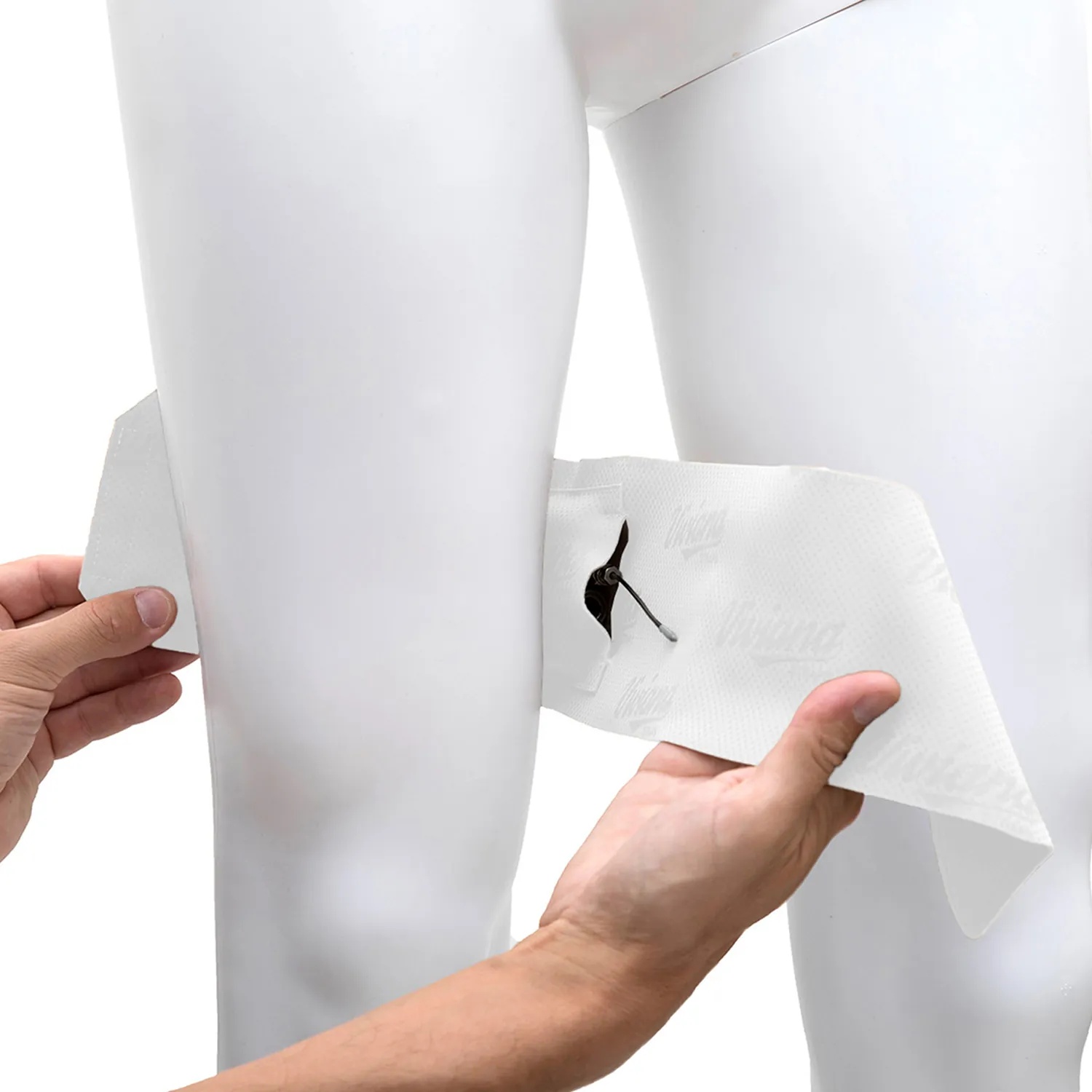 Viviana Straps Extreme Thigh (Horizontal Pouch) in white, held open against a mannequin's thigh to show the transmitter in its horizontal pouch.