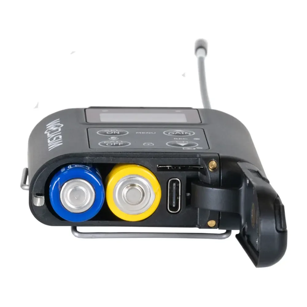 Wisycom MTP60 Multiband Bodypack Transmitter: The MTP60 from above, battery bay open with AA cells and USB-C port.